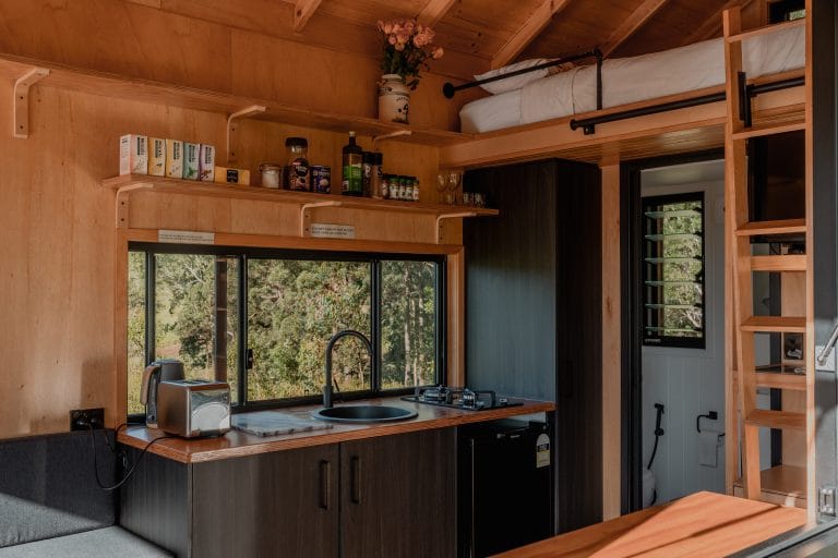The Tiny House kitchen with the hinterland view through the window