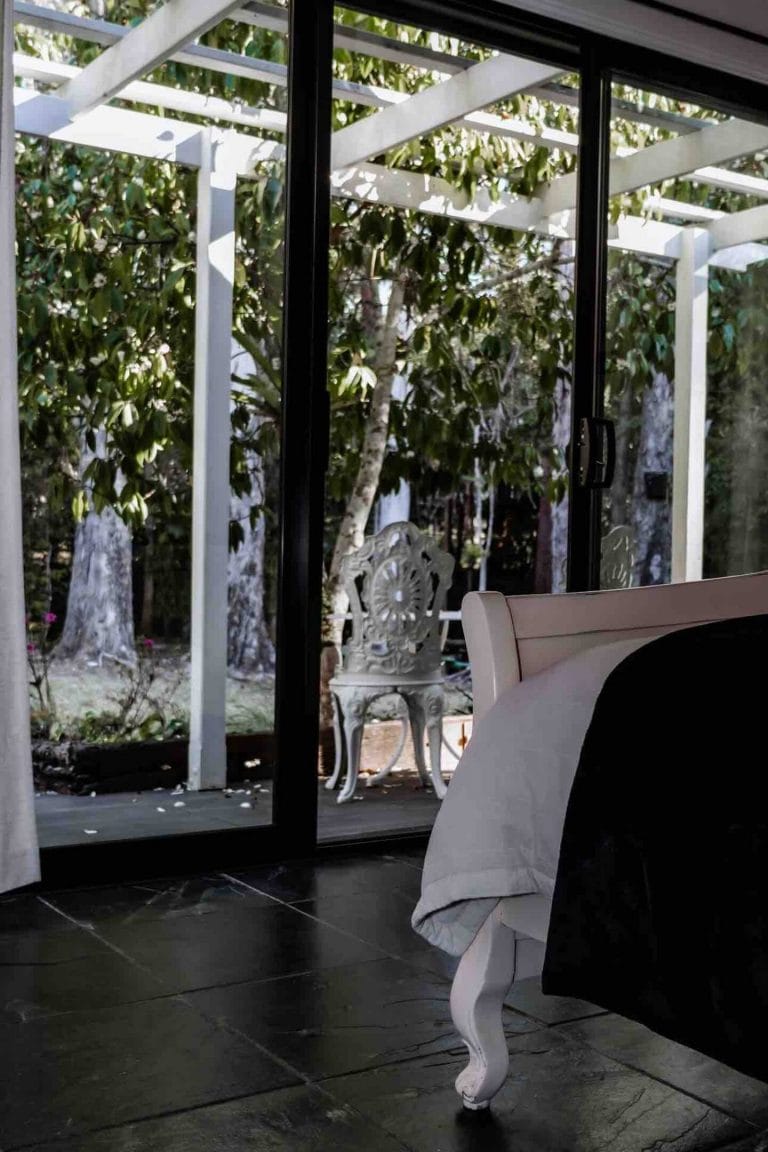 A bedroom window looking out to the trees