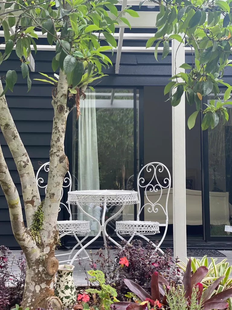 The courtyard with a cafe table and chairs
