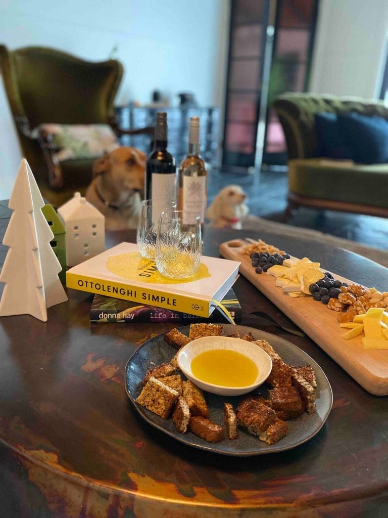 A cheese board and wine on the table