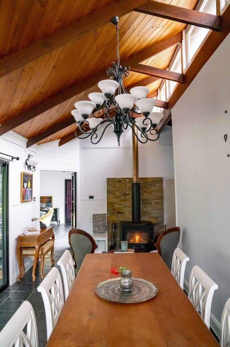 The lounge with the wood fire and chandelier