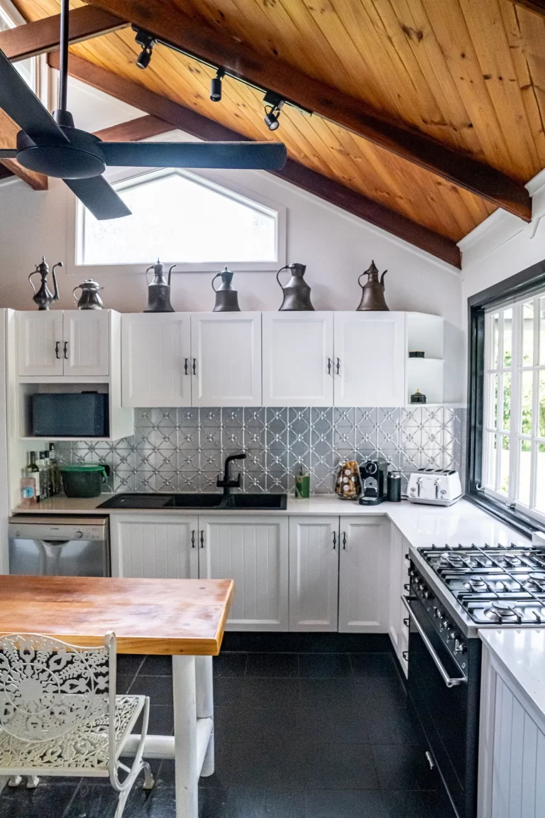 The white kitchen with a gas cooktop
