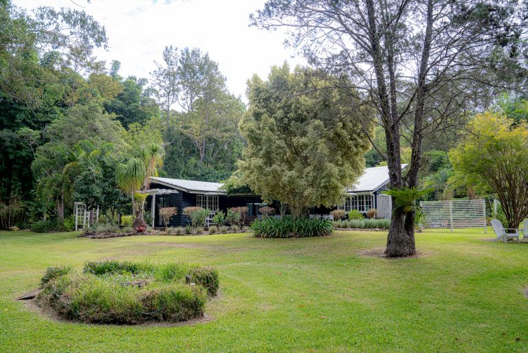 Bahche House seen across the lawn and the circular garden bed