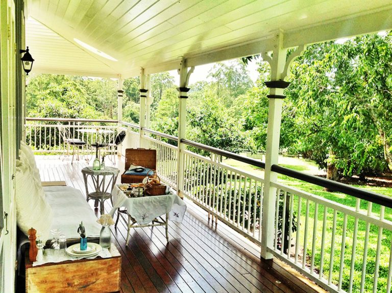 The wrap-around veranda of Dovecote Cottage with its seating